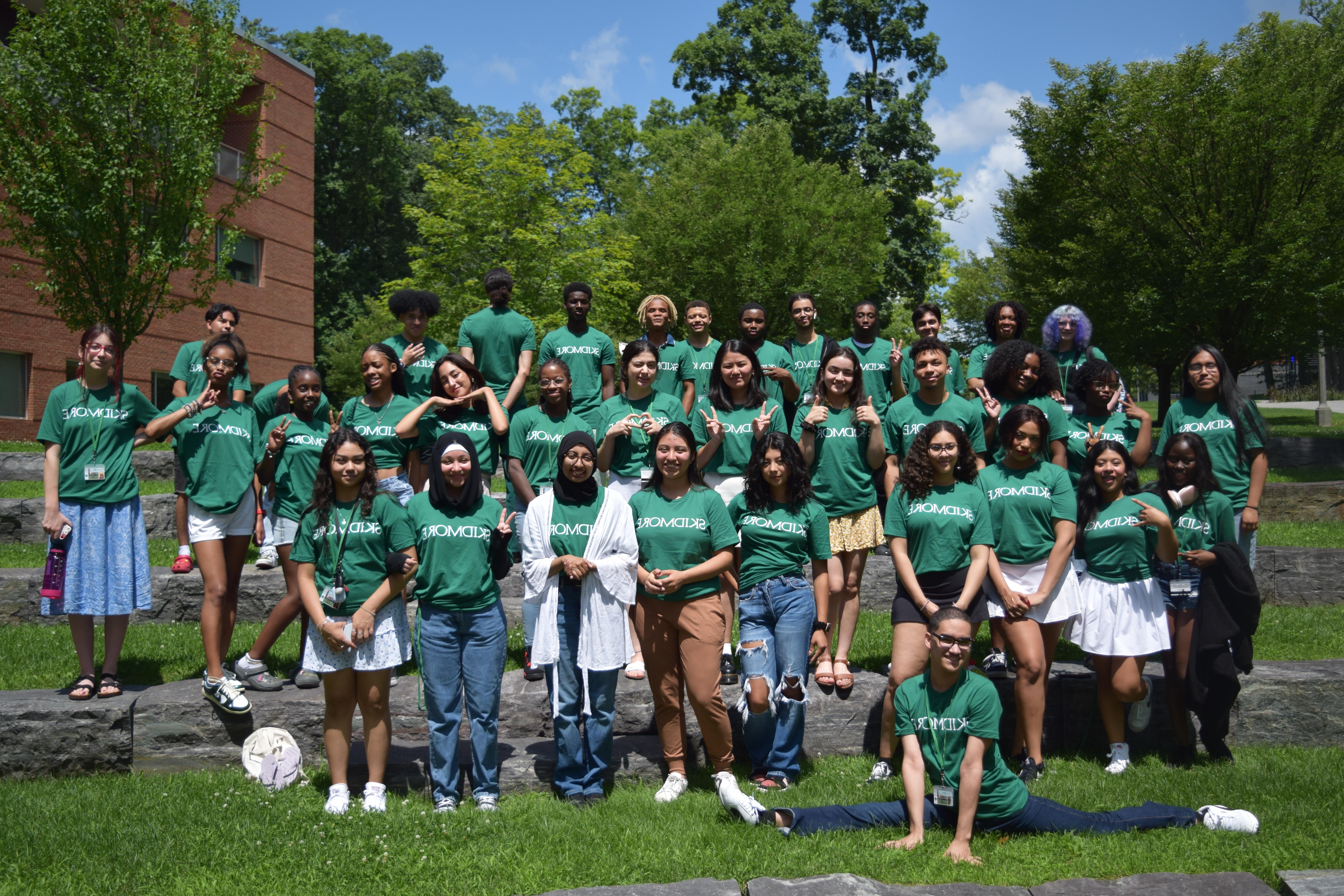 Students wearing green t-shirts that say Skidmore